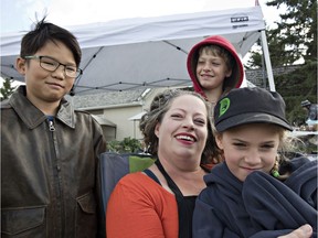 The Dimond Family Farm works together at the Meadow Lake Farmers' Market. From left to right are Bo, mother Minda and her daughter Charlie, with Owen in the rear. (Photo by Richard Marjan)