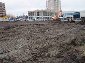 Earth-moving machines sit on the Capital Pointe site at the intersection of Albert Street and Victoria Avenue where work to fill the hole at that spot is nearly completed.