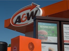 A plant-based burger advertisement is displayed on the drive-thru menu at the A&W store on Albert Street South.