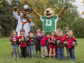 Dr. Goodbear and Gainer the Gopher cheer with children from the YWCA Child Development Centre as the Saskatchewan Roughrider Foundation and the Jim Pattison Children's Hospital Foundation announce the Touchdown for Kids Millionaire Lottery. Photo taken in Saskatoon, Sask. on Sept. 20, 2019.