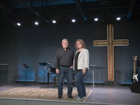The former Austrian Club has undergone extensive renovations to facilitate the growing Regina Victory Church. Pastor Terry Murphy and his wife Pastor Terri stand in the sanctuary.