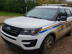 An RCMP vehicle was fired at by a man wielding a shotgun on Sept. 26. The man was being escorted home by an officer after being charged with impaired driving and refusal to submit a breath test. (RCMP).