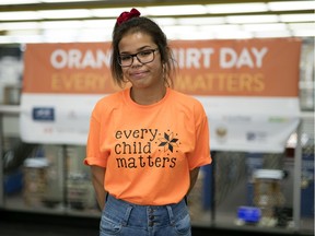 Grade 11 student Erika Bellegarde of Balcarres Community School  poses for a photo during Orange Shirt Day  at the main branch go the Regina Public Library in Regina.  Orange Shirt Day was developed to open the door to global conversation on all aspects of residential schools.