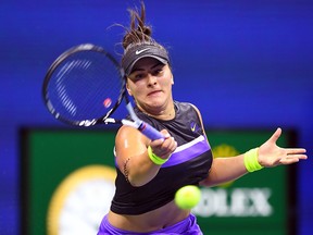 Bianca Andreescu hits a return to Belinda Bencic during their U.S. Open semifinal at the USTA Billie Jean King National Tennis Center in New York on September 5, 2019. (JOHANNES EISELE/AFP/Getty Images)