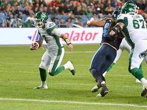 A strong showing by quarterback Cody Fajardo, shown scoring on an eight-yard run, helped the Saskatchewan Roughriders defeat the host Toronto Argonauts 41-16 and clinch a playoff berth Saturday.