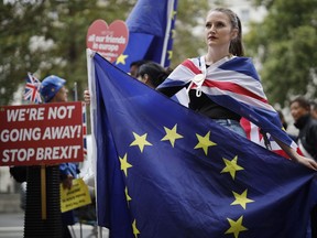 Anti-Brexit activists, and demonstrators opposing the British government's actions in relation to the handling of Brexit, protest near Downing Street in central London on September 10, 2019.