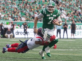 Saskatchewan Roughriders quarterback Cody Fajardo is tackled by Montreal Alouettes linebacker Patrick Levels (3) during a game at Mosaic Stadium.