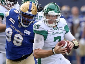 Cody Fajardo, right, and the Saskatchewan Roughriders were dominated by the Winnipeg Blue Bombers in Saturday's Banjo Bowl.