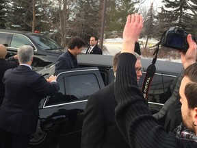 After meeting people at the University of Regina, Trudeau rode in a Cadillac limousine. DALE EDWARD JOHNSON