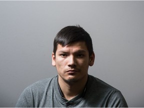 Cody Lee Francis sits in the John Howard Society office on Toronto Street.