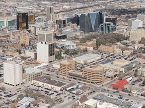 An aerial photo shows Regina's downtown including the Hill Towers, the SGI building, the Court of Queen's Bench, the Hotel Saskatchewan, the Capital Pointe hole and other city landmarks.