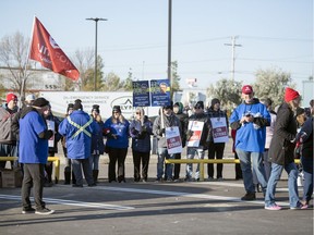 Striking SaskTel employees gathered and blocked managers from entering the call centre on Henderson Street in Regina on Oct. 7, 2019 (Troy Fleece / Regina Leader-Post)