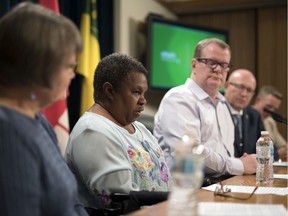 Pilot project participant Naomi Miller, second from left, speaks at the Legislative Building about a new program that will give eligible Saskatchewan residents secure access to their personal health information.