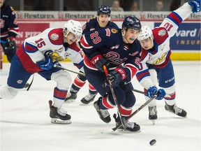 REGINA, SASK : October 8, 2019  -- The Regina Pats' Logan Nijhoff (29) carries the puck while being pursued by the Edmonton Oil Kings' Scott Atkinson (15) and Vladimir Alistrov (10) during a WHL hockey game at the Brandt Centre. BRANDON HARDER/ Regina Leader-Post