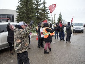 Unifor members continue their strike action at a SaskTel building located near the airport in Regina.