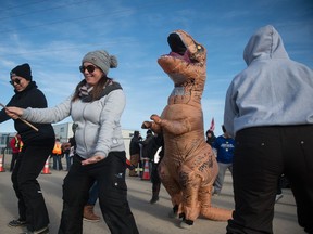 Striking Unifor members dance at a blockade in front of a SaskEnergy property near White City.