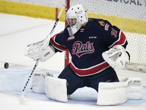 Regina Pats goalie Danton Belluk makes a save against the Vancouver Giants during WHL action at the Brandt Centre on Oct. 12.