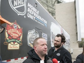 Derek King — the NHL's senior manager, facilities operations and hockey operations — meets with reporters Tuesday outside Mosaic Stadium, with the leagues Mobile Refrigeration Unit in the background.