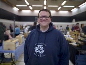 Undecided voter Creighton Widdis of Regina stands in the Core Ritchie Neighbourhood Centre gymnasium where a farmers market was being held.