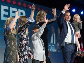 Leader of the Conservative Party of Canada Andrew Scheer and family wave at the crowd at the Conservative headquarters at the International Trade Centre at Evraz Place.