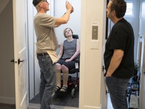 Bonnie Gorski and her husband Stuart get instructions on their new in-home elevator from Gerry Andrushuk as part of their newly renovated home in Regina.