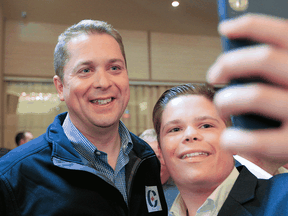 Conservative leader Andrew Scheer poses for a picture while campaigning in Halifax, Nova Scotia, Oct. 3, 2019.