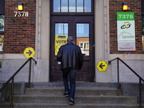 A man enters a polling place to cast his ballot for today's election in Montreal, Quebec, Canada, October 21, 2019.