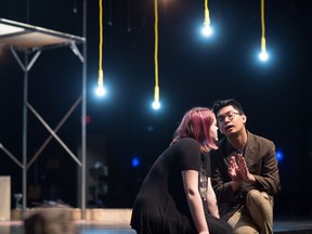 Bryan Luansing, right, goes over a scene from rock musical Spring Awakening with rehearsal stand-in Chelsea Laing.