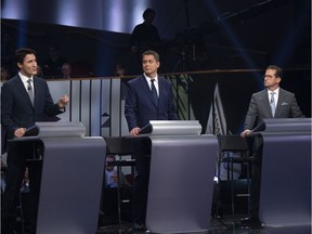 CP-Web. Federal party leaders, left to right, Liberal leader Justin Trudeau, Conservative leader Andrew Scheer, and Bloc Quebecois leader Yves-Francois Blanchet take part in the Federal leaders French language debate in Gatineau, Que. on Thursday, October 10, 2019.