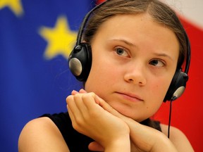 Swedish environmental activist Greta Thunberg attends a debate with French parliament members at the National Assembly in Paris, France, July 23, 2019.