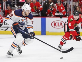 Edmonton Oilers centre Leon Draisaitl (29) looks to shoot the puck against Chicago Blackhawks defenceman Olli Maatta (6) during the first period at United Center on Monday, Oct. 14, 2019.