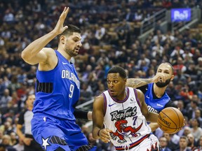 The Raptors' Kyle Lowry drives against the Orlando Magic's Nikola Vucevic on Monday night at the Scotiabank Arena. (Ernest Doroszuk/Toronto Sun)