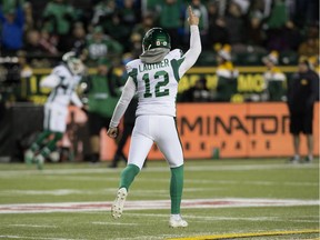 The Saskatchewan Roughriders' Brett Lauther (12) celebrates his game-winning field goal against the host Edmonton Eskimos on Saturday.