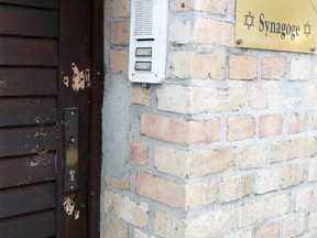 Bullet holes are seen on October 10, 2019 at a door of the synagogue in Halle, eastern Germany, one day after the attack where two people were shot dead.