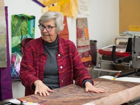 Fibre artist Martha Cole demonstrates how her stitching machine works, allowing her to "paint" with thread. Cole will receive the Lifetime Achievement Award at the Saskatchewan Arts Awards on Nov. 4, 2019, in Saskatoon.