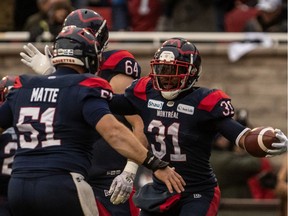Montreal Alouettes running back William Stanback (31) is congratulated by teammate Montreal Alouettes guard Kristian Matte (51) after scoring a touchdown in Montreal on Sunday Nov. 10, 2019.