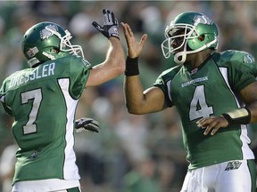 REGINA, SK :  JULY 5, 2013 --  Saskatchewan Roughriders slotback Weston Dressler (#7) and Saskatchewan Roughriders quarterback Darian Durant (#4) celebrate a two point conversion in second half CFL action at Mosaic Stadium in Regina, Sask. on Friday, July 5, 2013.   The Riders defeated the Stamps 36-21.