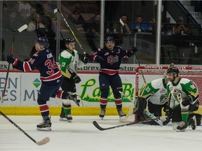 REGINA, SASK : September 27, 2019  -- The Regina Pats' Riley Krane (34) and Austin Pratt (10) celebrate following a goal during a WHL hockey game against the Prince Albert Raiders at the Brandt Centre. BRANDON HARDER/ Regina Leader-Post