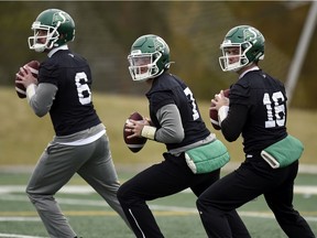 Saskatchewan Roughriders QBs Bryan Bennet, from left, Cody Fajardo and Isaac Harker during practice at the University of Regina.