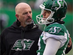 Head coach Craig Dickenson, left, encourages Brett Lauther after one of his four missed field-goal attempts in Saturday's 23-13 victory over the visiting Edmonton Eskimos.