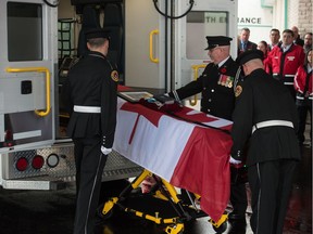 An honour guard unloads a stretcher bearing a Canadian flag and personal items at the funeral of Leigh Schroeder, a Primary Care Paramedic with the Saskatchewan Health Authority EMS in Meadow Lake who died while on an EMS call. The service was held at  Living Hope Alliance Church on Green Falls Drive in Regina.