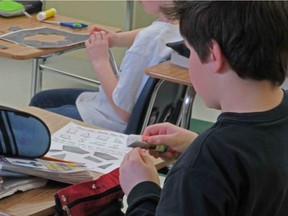 Students at Carrot River Jr. Sr. High School learn about the dream catcher during a math lesson where students built their own dream catcher and then identified the geometric shapes within it. (Photo courtesy of Glen Aikenhead)