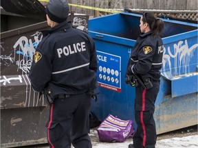 Saskatoon police responded on Nov. 8, 2019 to the discovery of an infant's body in a recycling bin the 400 block of Fifth Avenue North. (Matt Smith / Saskatoon StarPhoenix)