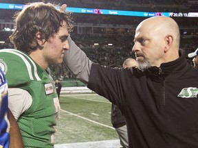 Saskatchewan Roughriders head Craig Dickenson, right, consoles quarterback Cody Fajardo after a 20-13 loss to the Winnipeg Blue Bombers in the 2019 West Division final.