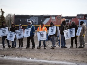 Striking CN Rail workers stand out front the CN rail yards on 1st Avenue North in Regina on Nov. 19/2019.