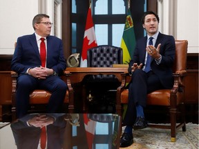 Prime Minister Justin Trudeau meets with Premier Scott Moe in the premier's office at the Legislative Building in Regina on March 9, 2018.