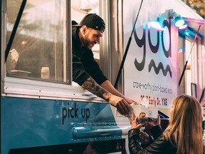 Gud Eats founder Chris Cole serves patrons from his Saskatoon-based food truck.