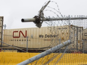 A Canadian National Railway Co. container sits at the Intermodal Terminals in Brampton, Ont. About 3,200 workers at CN Rail reached a tentative deal, Tuesday.