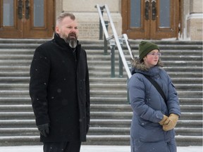 Saskatchewan Environment Minister Dustin Duncan stands next to 13-year-old climate activist Ada Dechene at the Saskatchewan Legislative Building during a climate rally on Friday, Nov. 29, 2019.