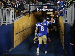 Winnipeg Blue Bombers quarterback Zach Collaros (8) celebrates with fans after defeating the Calgary Stampeders in CFL action in Winnipeg Friday, October 25, 2019.